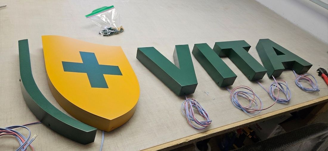 Backlit dimensional letters with crest