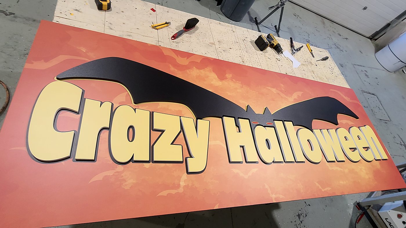 Dimensional cut letters on a large-format printed panel