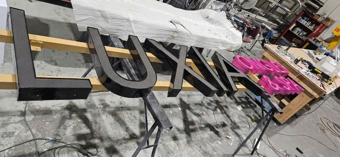 Illuminated channel letters wrapped in Dual Color vinyl